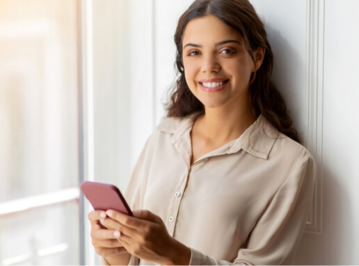happy-young-woman-holding-smartphone-and-smiling-w-2024-03-25-23-33-29-utc (2)